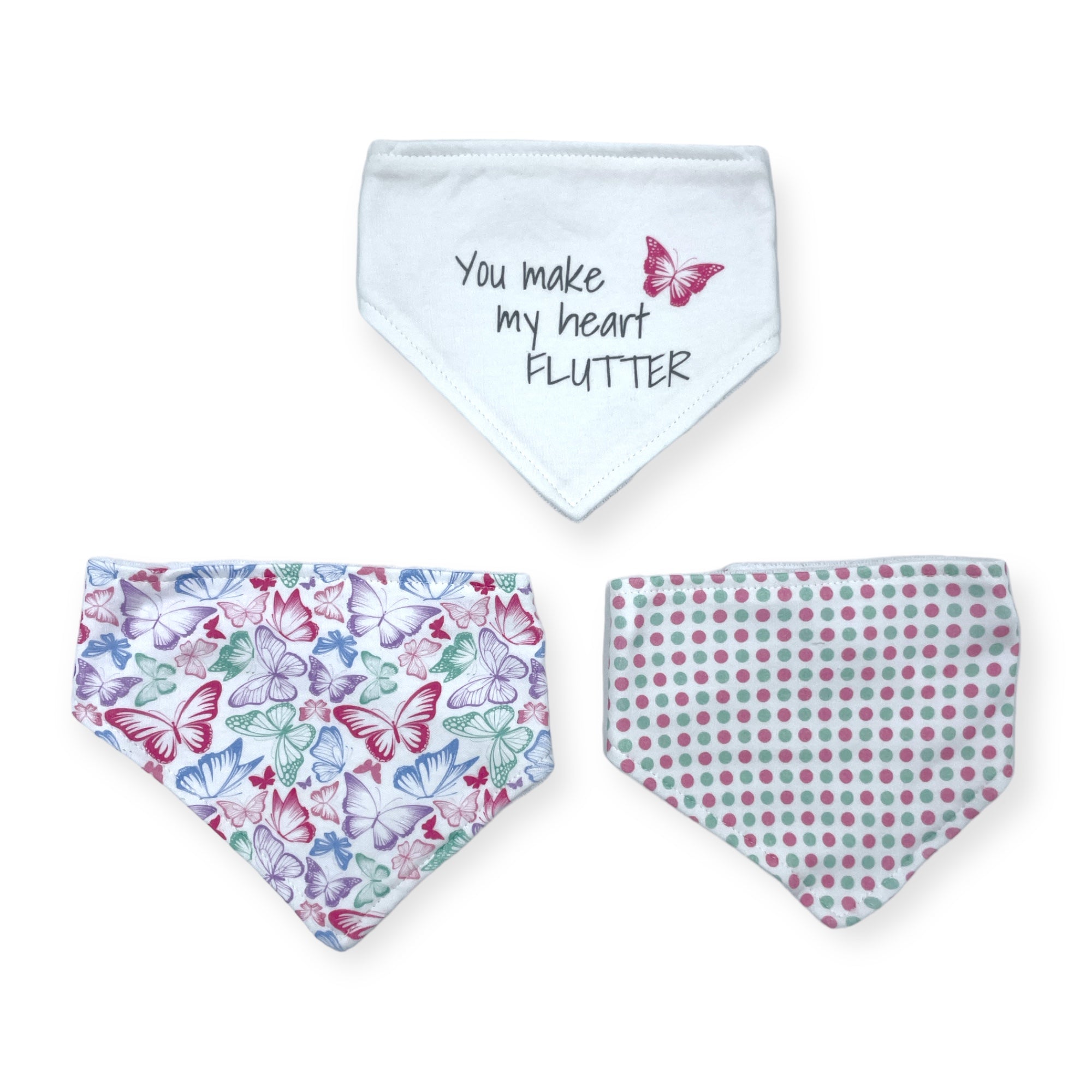 Three dog bandanas with butterfly and polka dot patterns on a white background