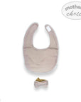 Beige baby bib with a small bow on a white background, featuring 'mother's choice' branding.