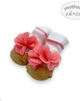 Baby booties with pink flowers on a white background, branded 'Mother's Choice'.