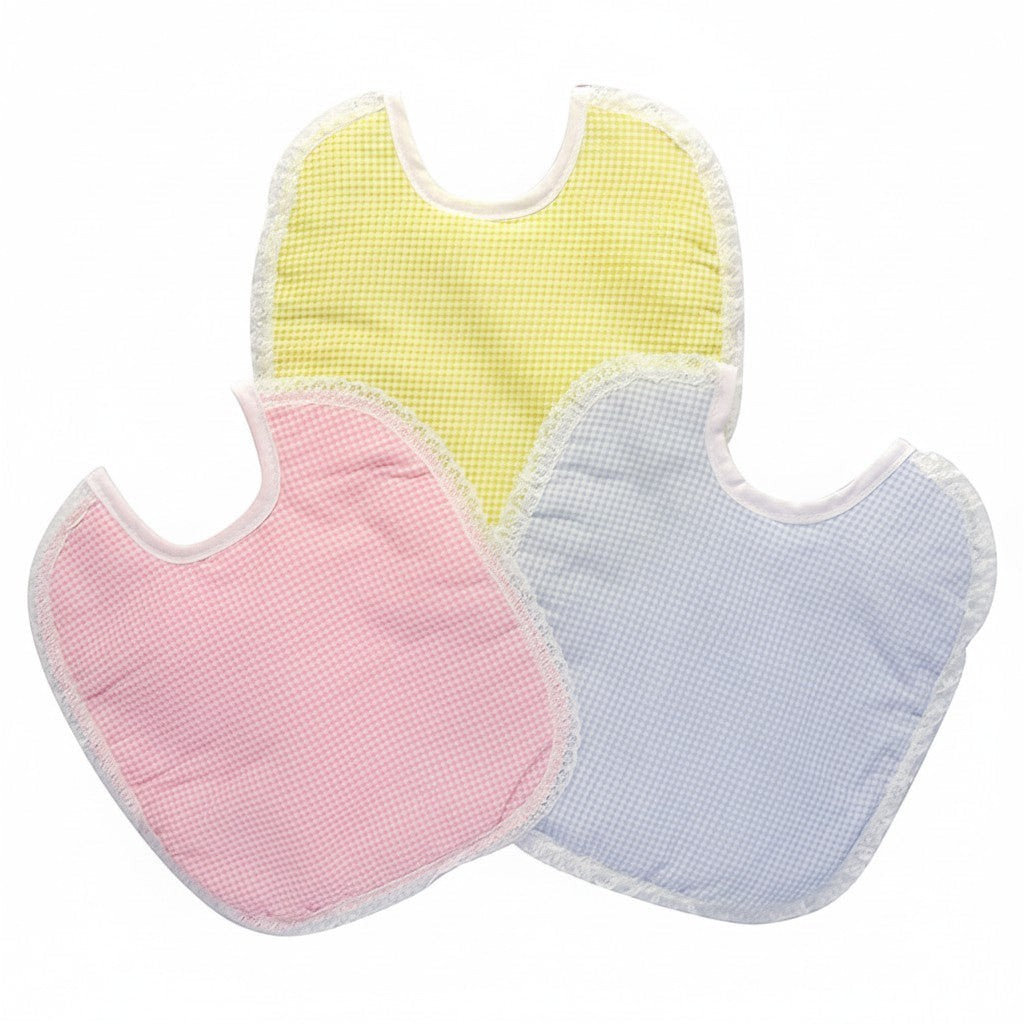 Three baby bibs in yellow, pink, and blue on a white background