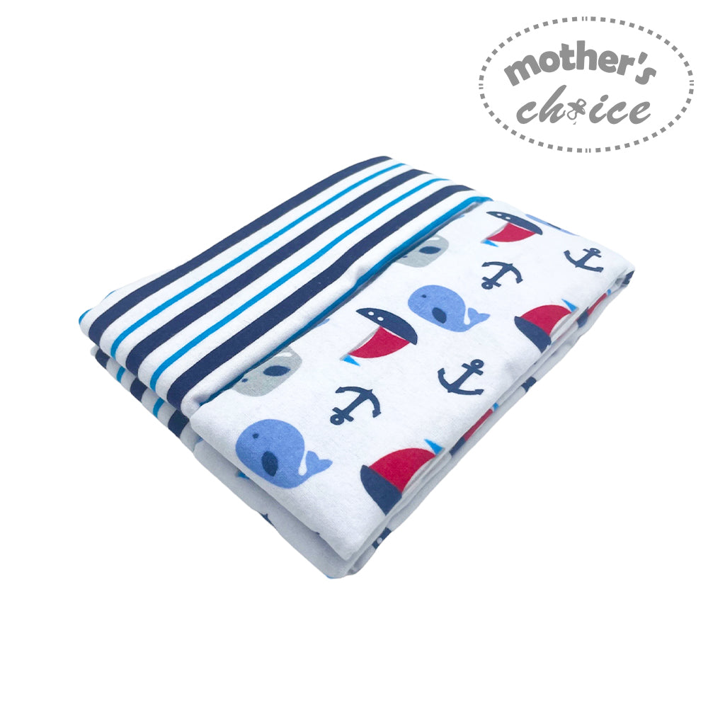 Folded fabric with nautical patterns on a white background, featuring 'mother's choice' branding.