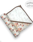 Floral-patterned baby blanket with brown border on a white background, featuring 'mother's choice' branding.