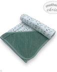 Folded baby blanket with floral pattern on one side and solid color on the other, branded 'Mother's Choice'.