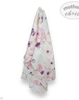 Floral-patterned towel with 'mother's choice' branding on a white background