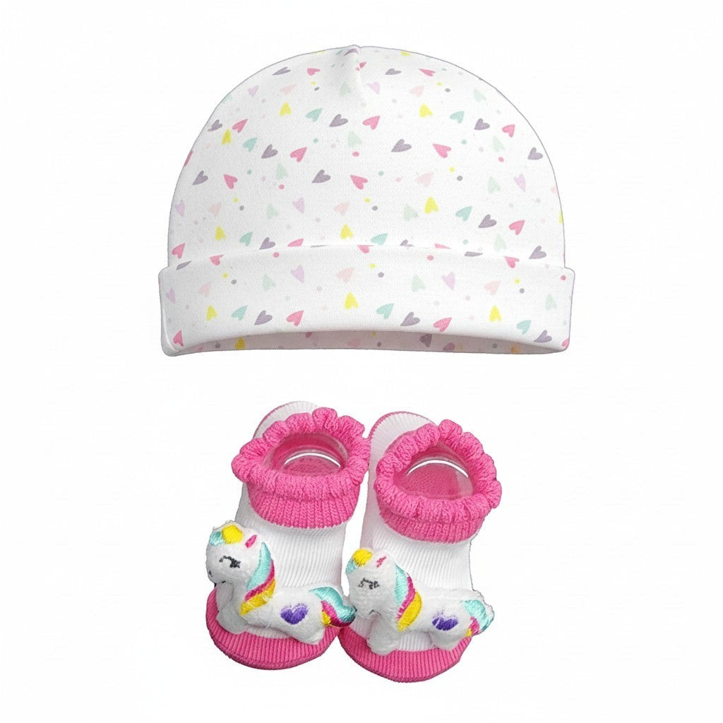Baby hat and booties set with unicorn design on a white background