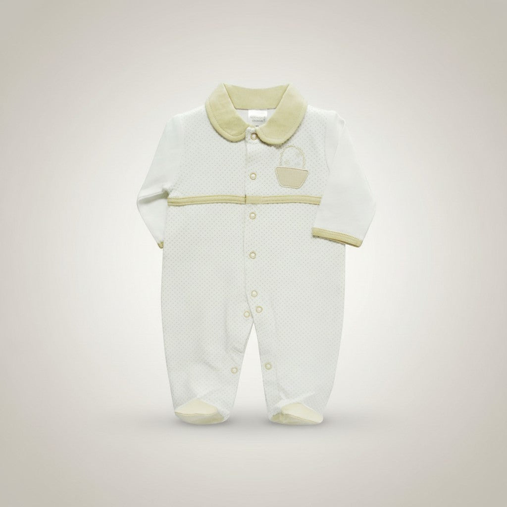 White baby onesie with green accents on a light gray background