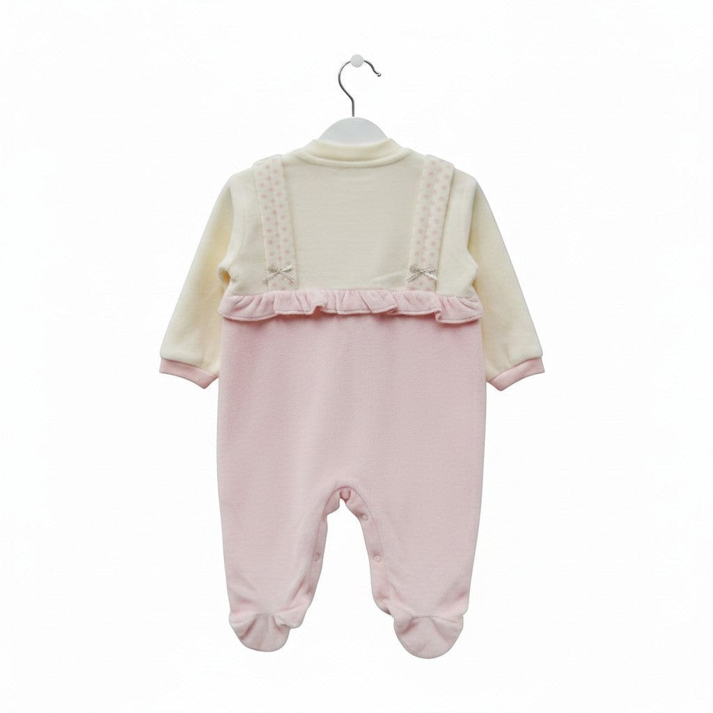 Baby romper with pink ruffled top and bottom on a white background
