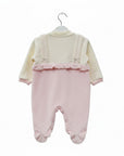 Baby romper with pink ruffled top and bottom on a white background