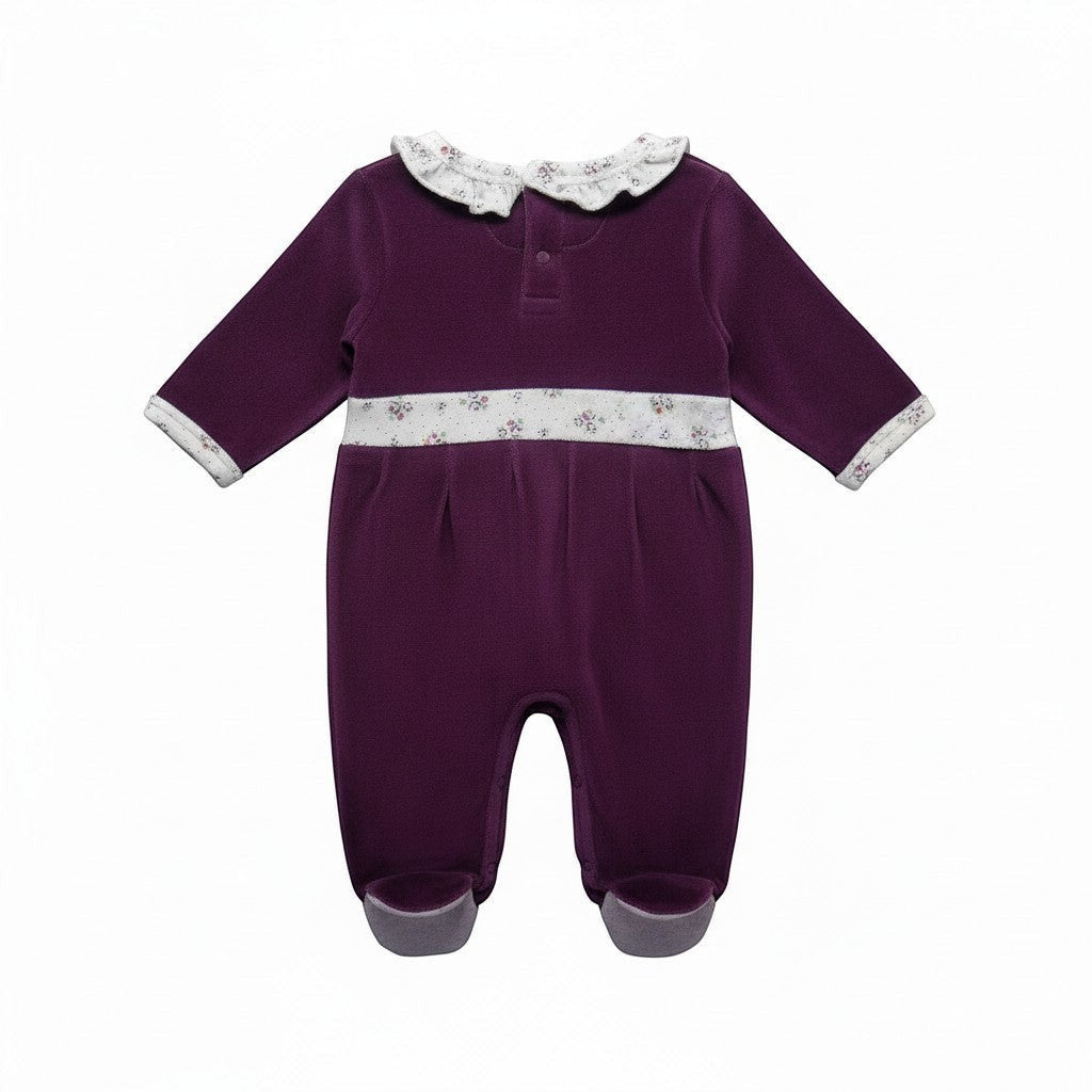 Purple baby romper with white trim on a white background