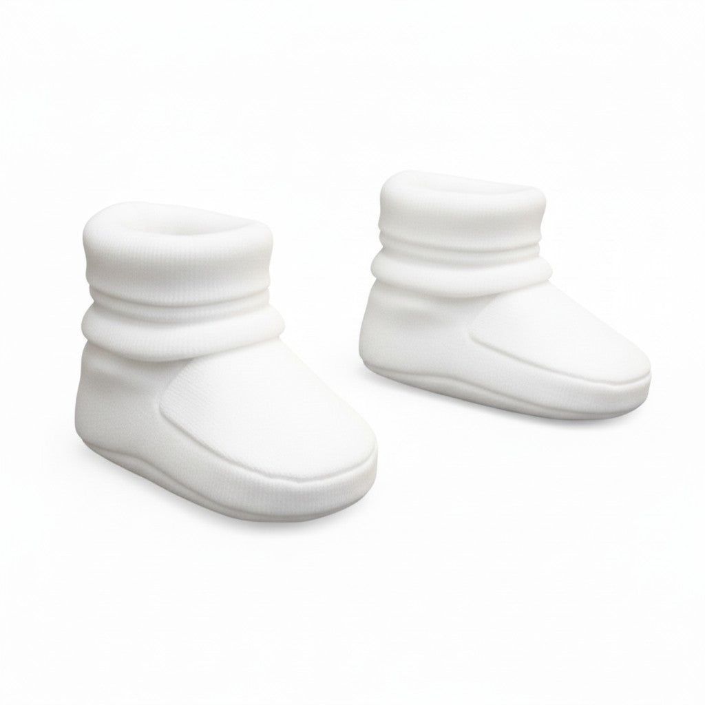 Pair of white baby booties on a white background