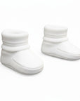 Pair of white baby booties on a white background