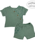 Green children's outfit with shirt and shorts on a white background, featuring 'mother's choice' branding.