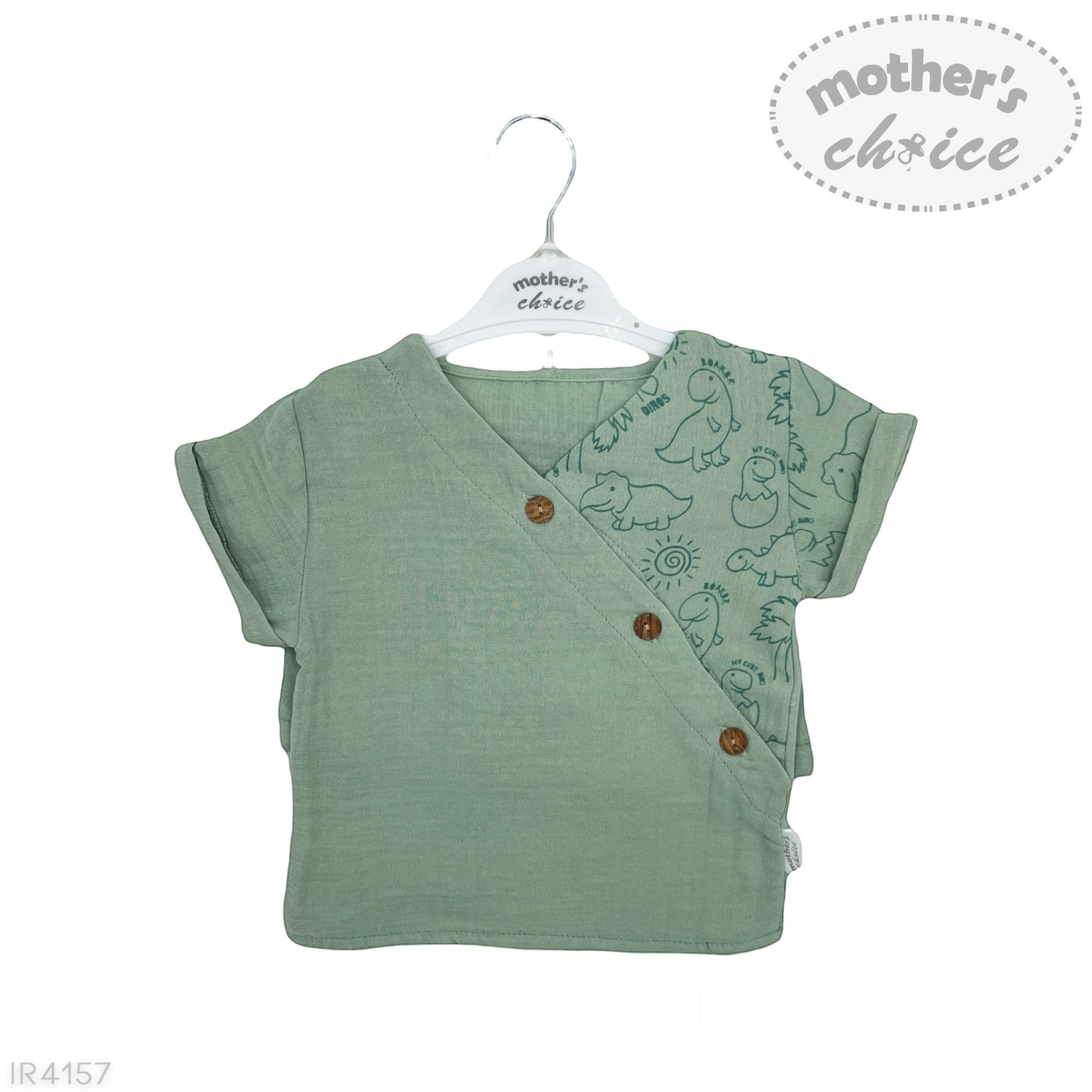 Green baby wrap top with dinosaur print on a hanger against a white background
