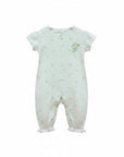 White baby romper with floral patterns on a white background