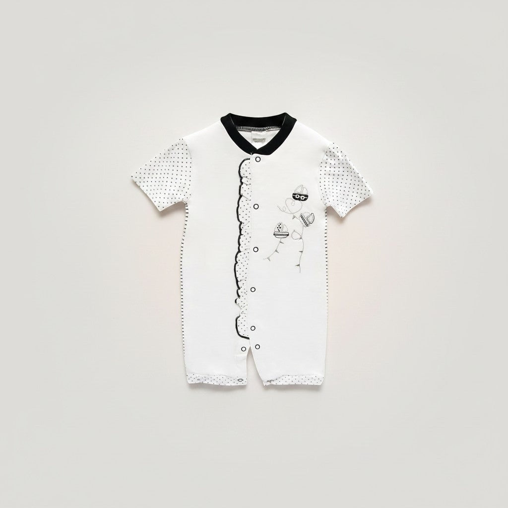 White baby romper with black accents on a light gray background