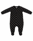 Black baby onesie with pink polka dots on a white background