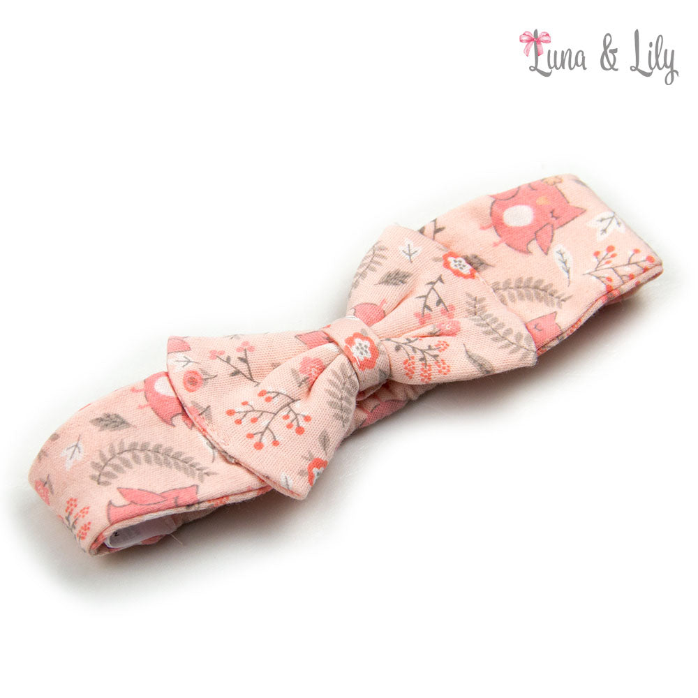 Pink fabric bow with nature-themed design on a white background, branded 'Luna &amp; Lily'.