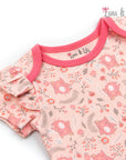 Baby romper with pink fox pattern and ruffled sleeves on a white background, branded 'Luna & Lily'.