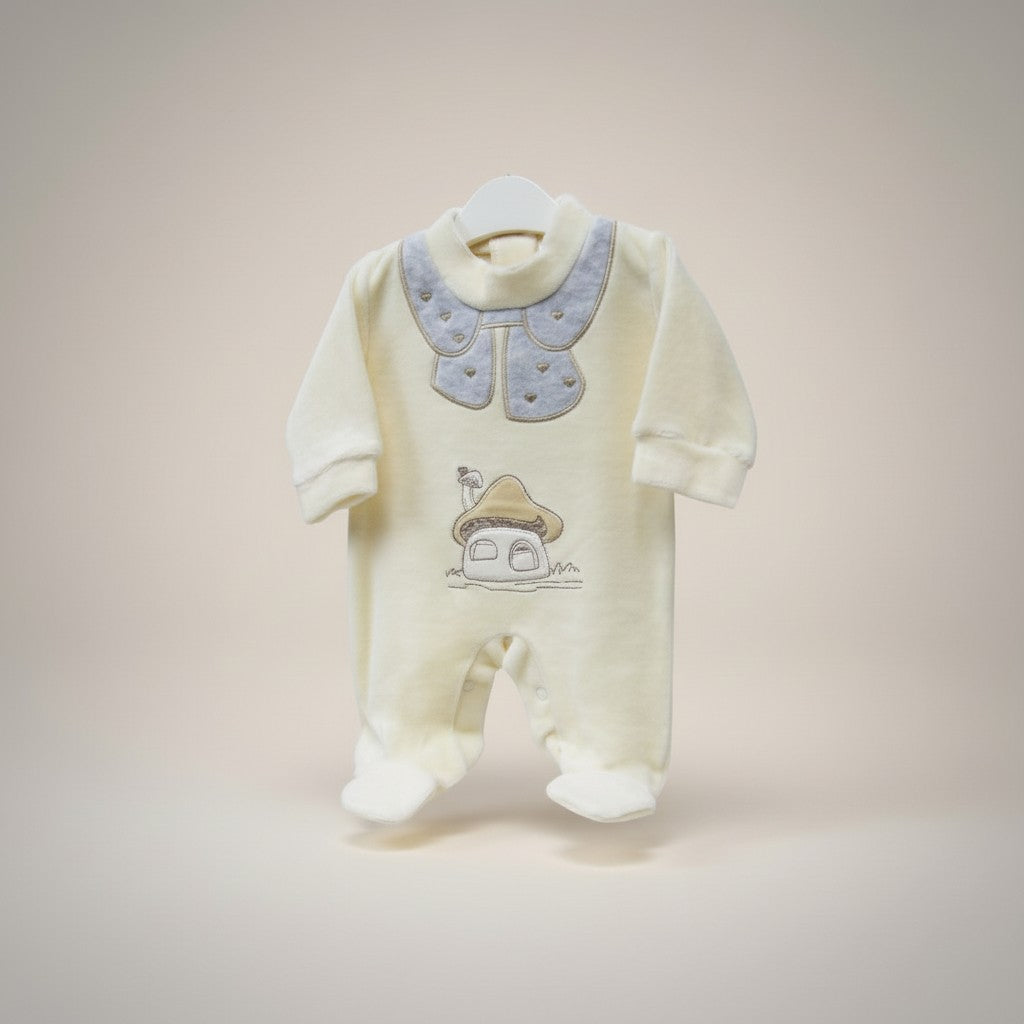 Baby onesie with embroidered design on a plain background