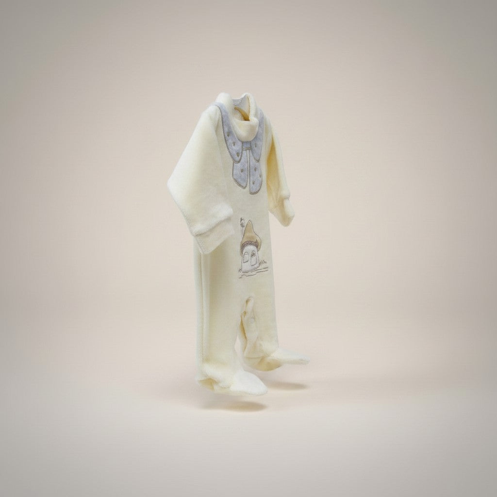 Baby outfit with bib and pants on a light pink background