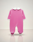 Pink baby onesie with a white collar on a light gray background