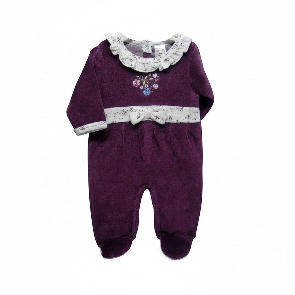 Purple baby outfit with floral details on a white background