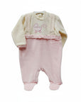 Pink baby outfit with cream top on a white background