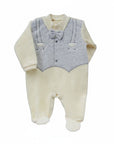 Baby outfit with cream top and pants and gray vest on a white background