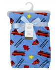 Baby blanket with fire truck and ladder pattern on a blue background, hanging on a white hook.