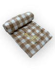 Checkered blanket with a giraffe design on a white background