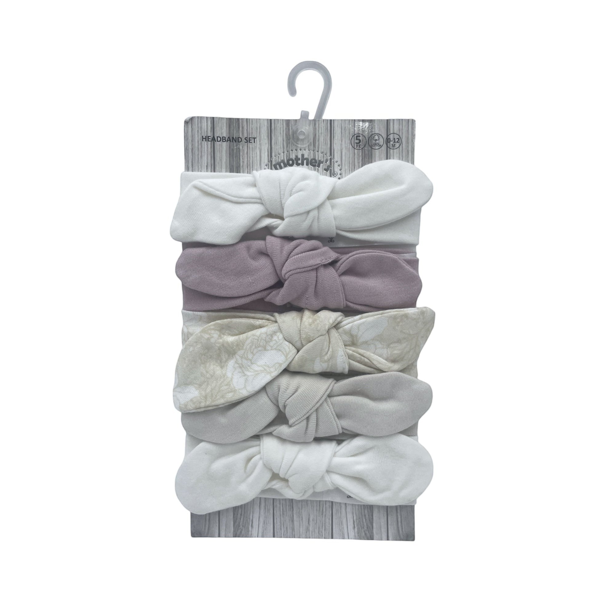 Set of baby headbands on a wooden hanger with 'Babbles' branding.