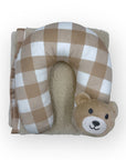 Neck pillow with checkered pattern and bear face design on a white background