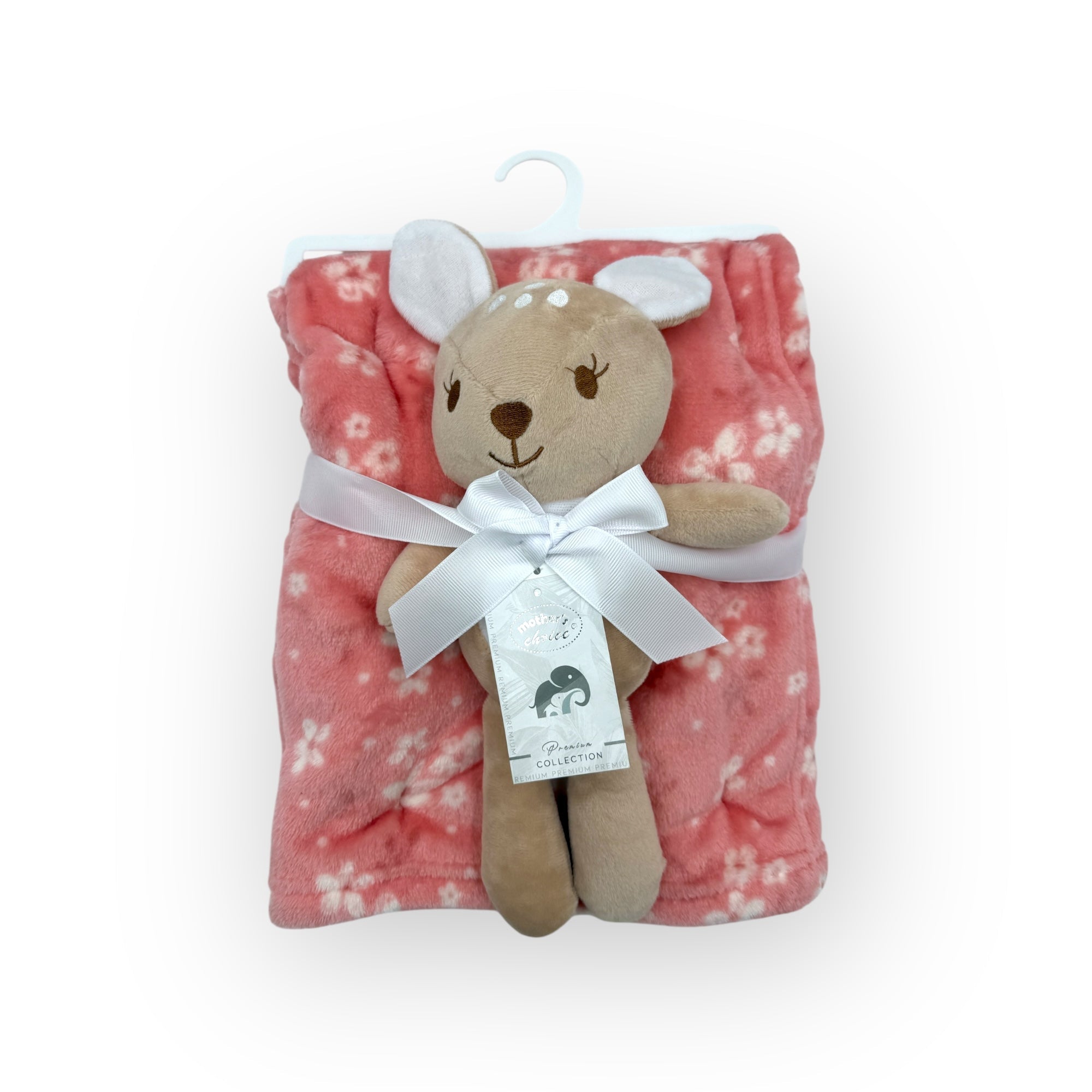 Plush teddy bear with a pink floral blanket on a white background