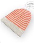 Striped baby hat with orange and beige pattern on a white background, featuring 'mother's choice' branding.