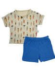 Children's outfit with patterned shirt and blue shorts on a white background