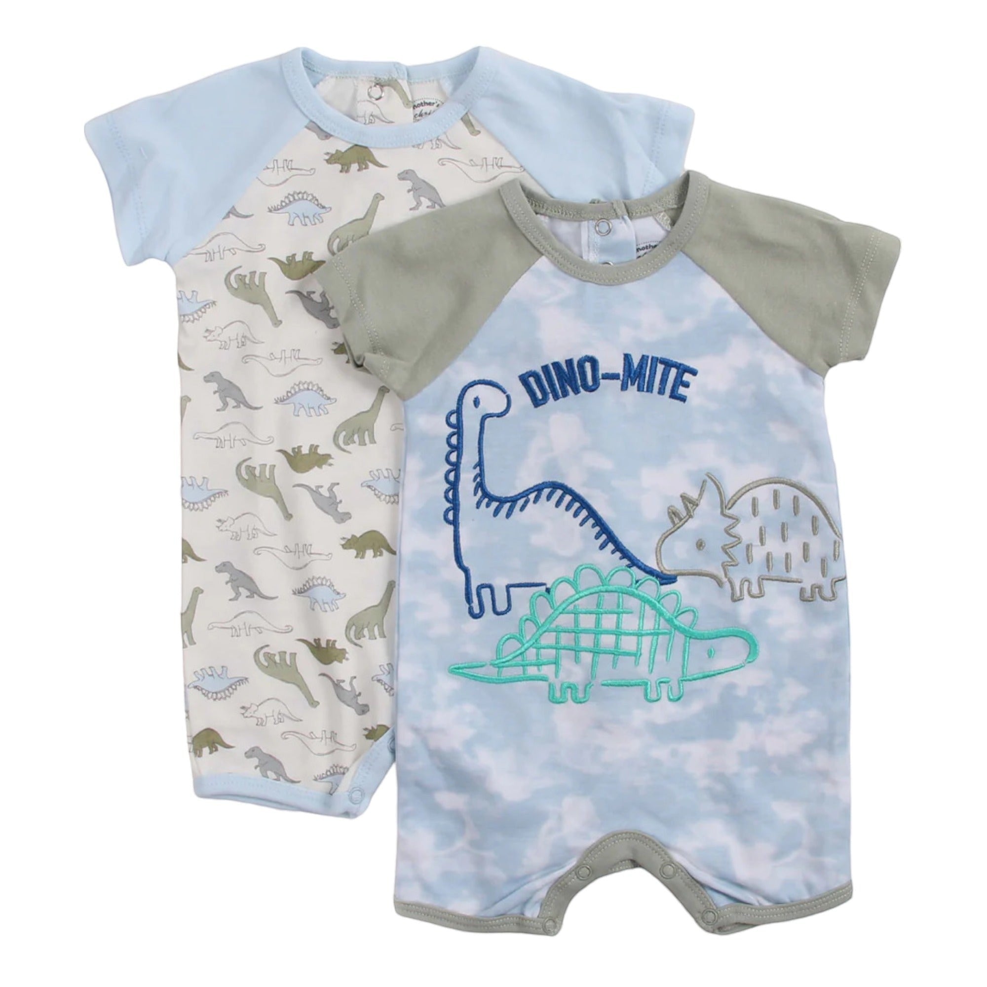 Two baby rompers with dinosaur designs on a white background