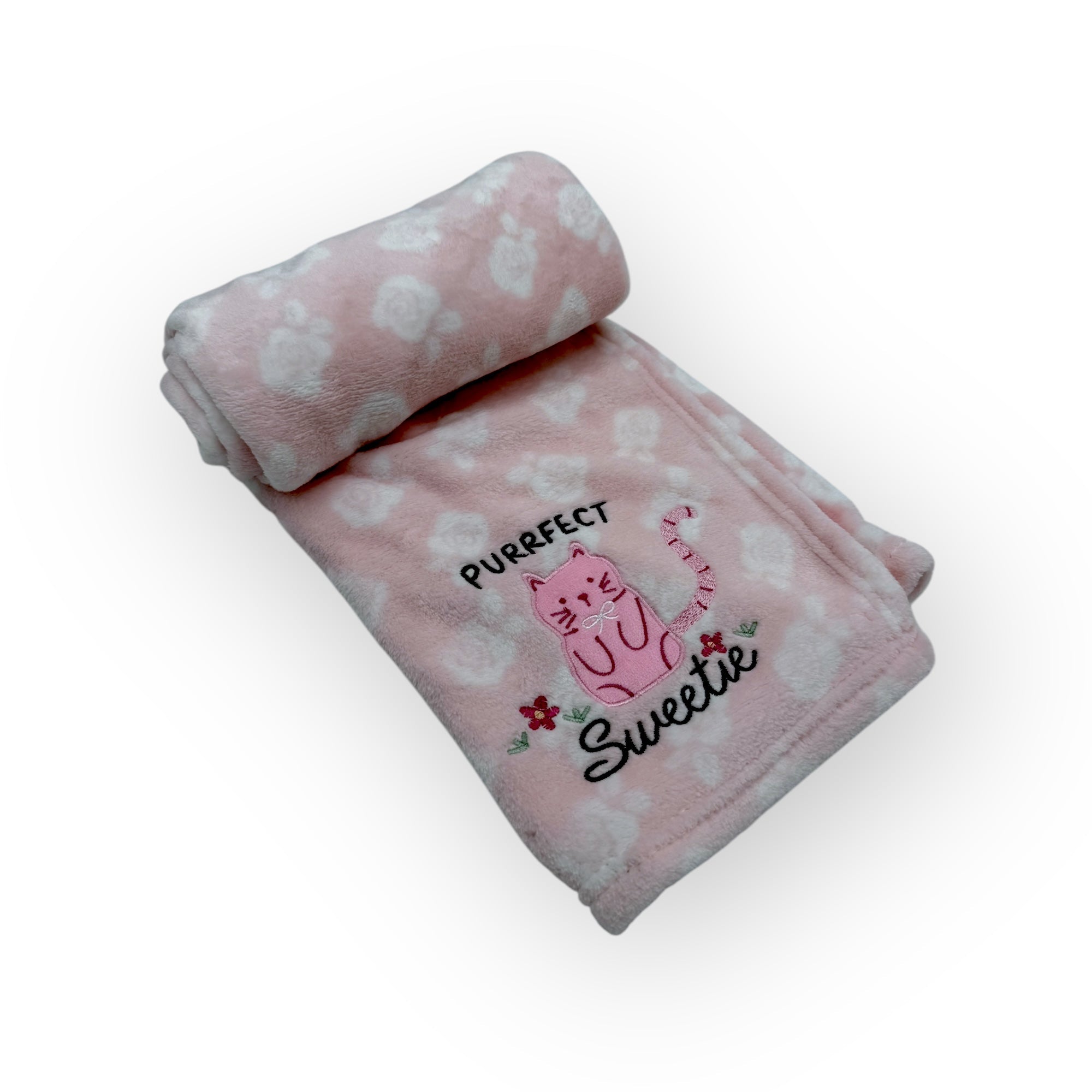 Pink blanket with cat design and text on a white background