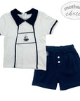 Children's outfit with white shirt and navy shorts on a white background, featuring 'mother's choice' branding.