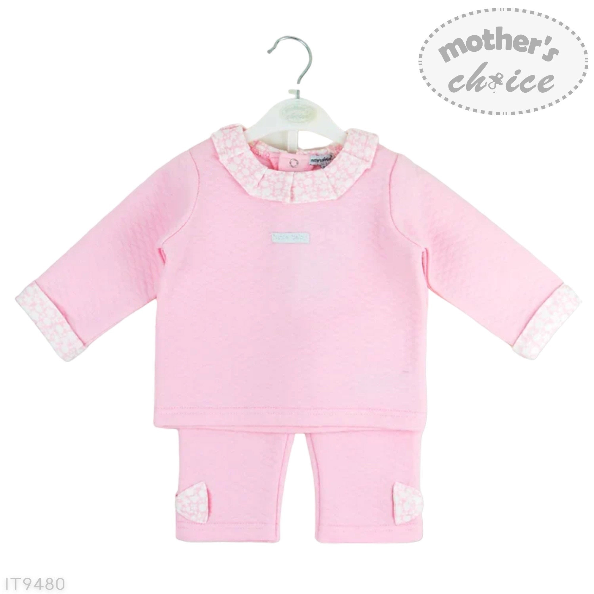Pink baby outfit with ruffled collar on a hanger, branded 'Mother's Choice'.