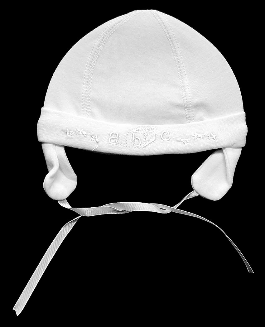 White baby hat with earflaps on a black background