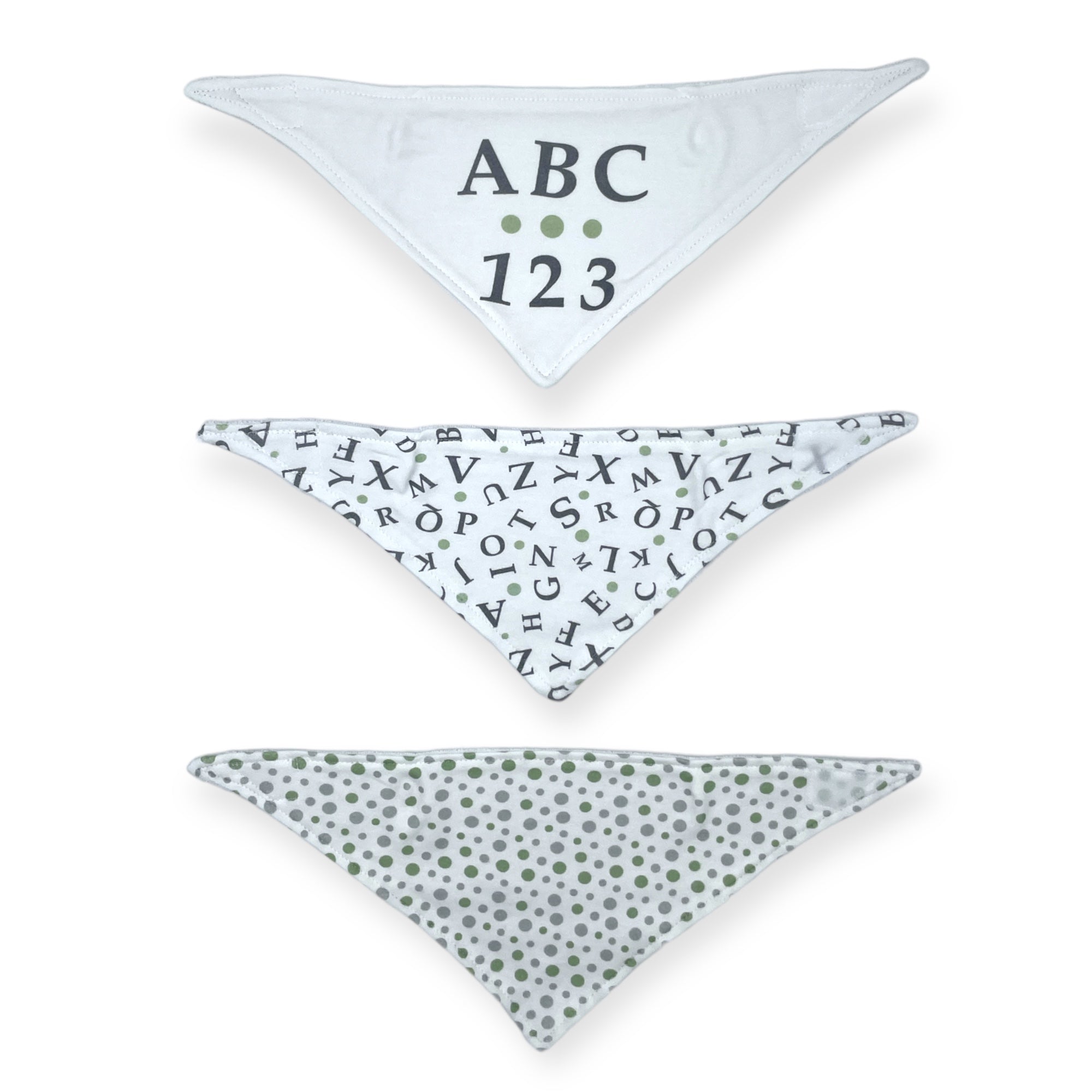 Three triangular bibs with different patterns on a white background