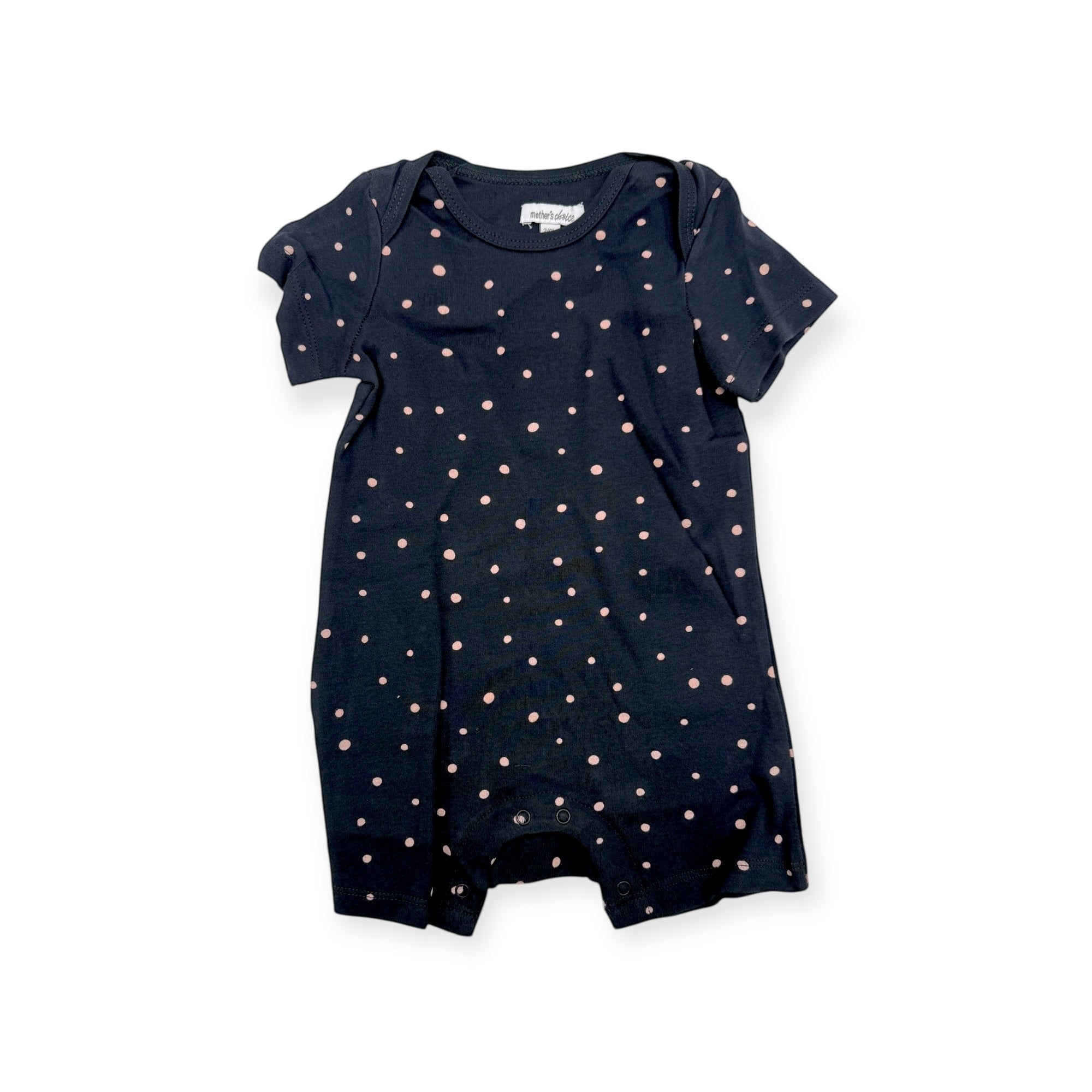 Navy blue baby romper with pink polka dots on a white background