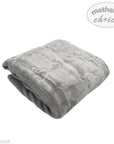 Gray plush blanket with heart designs on a white background, branded 'Mother's Choice'.