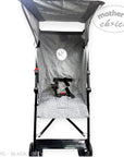 Black and gray stroller with canopy on a white background, featuring 'mother's choice' branding.