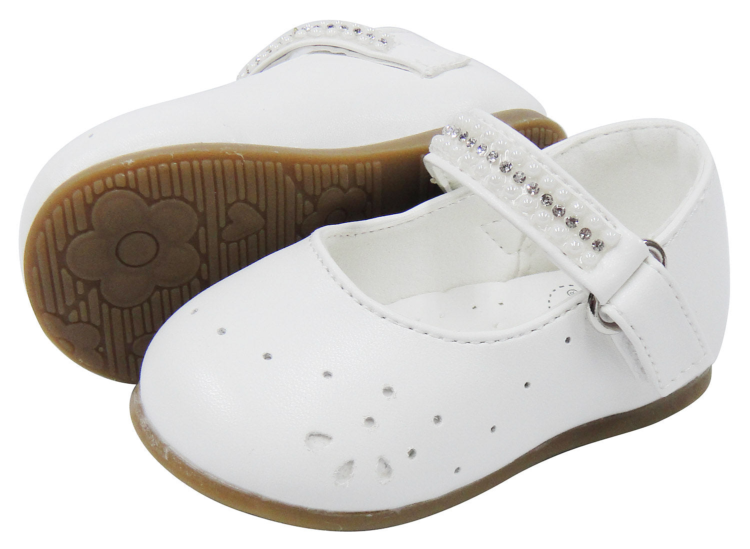 White children's shoes with a strap and brown soles on a white background