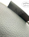 Close-up of a car headrest cover with 'mother's choice' branding on a light gray background.