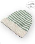 Striped beanie with green and beige colors on a white background, featuring 'mother's choice' branding.