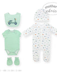 Baby clothing set with onesie, bodysuit, bib, and booties on a white background.