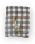 Plaid blanket with a giraffe design on a white background
