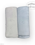 Two rolled-up towels, one gray and one blue, on a white background with 'Mother's Choice' branding.